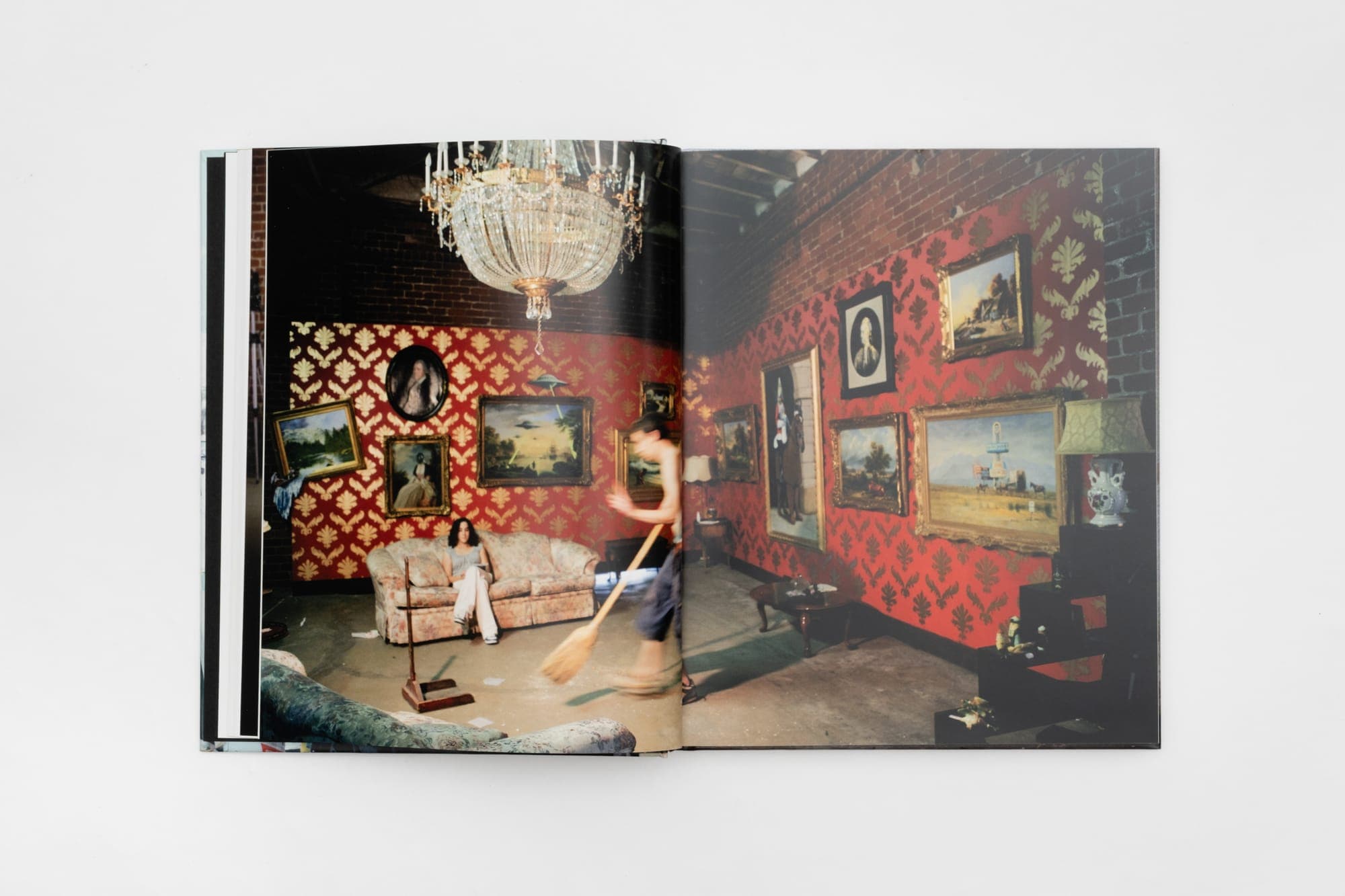 A red-printed interior spread from Banksy Captured